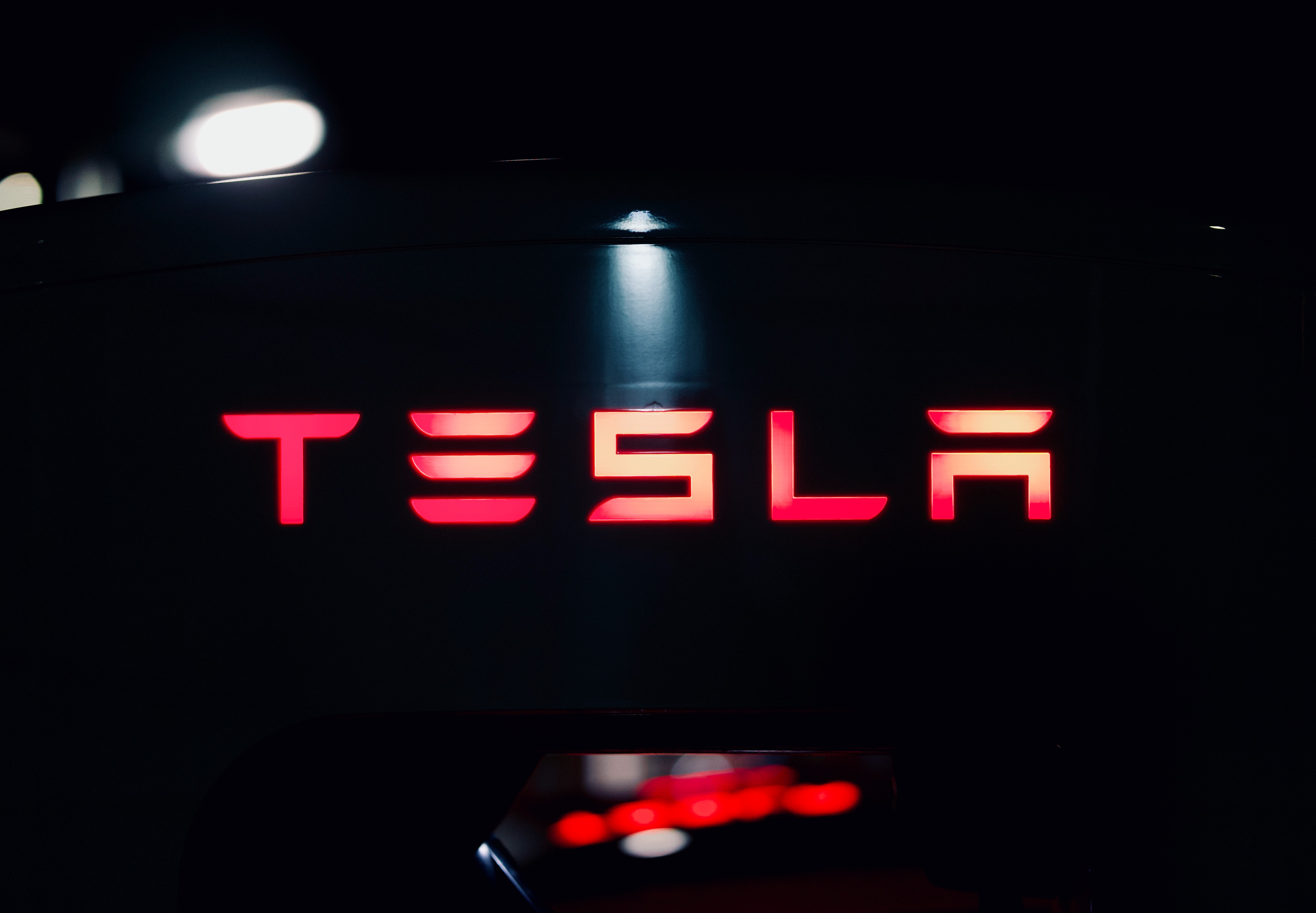 Tesla in red lights